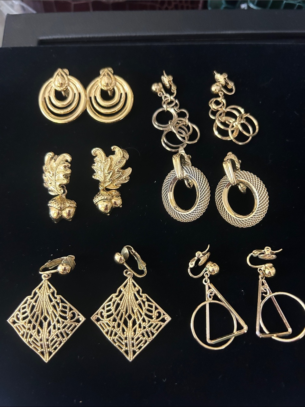 Vintage set of women’s clip on gold tone earrings